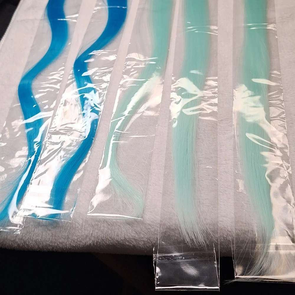 22-inch blue (2) and mint green (3) new in plastic clip in hair extensio…